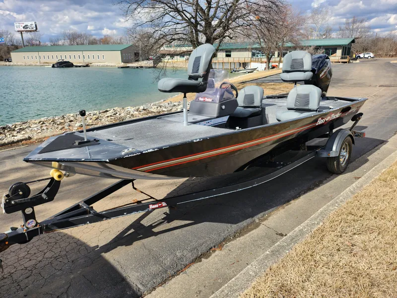 Slide: The Image of 2021 Tracker Bass Tracker Classic XL boat on trailer by a lake. - 8