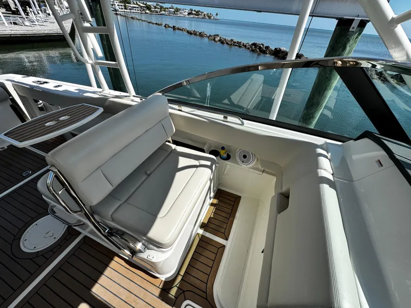 Slide: The Image of 2019 Boston Whaler 270 Vantage boat interior with seating and ocean view. - 37