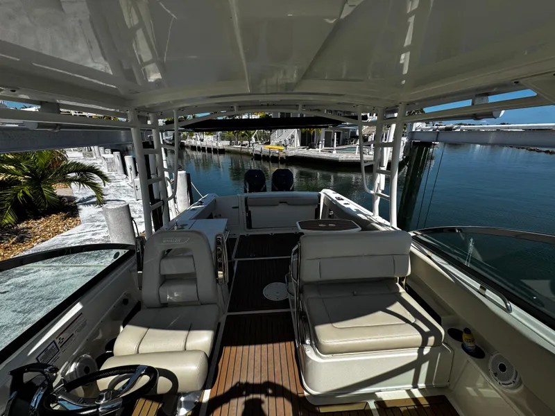 Slide: The Image of 2019 Boston Whaler 270 Vantage interior with seating and water view. - 38