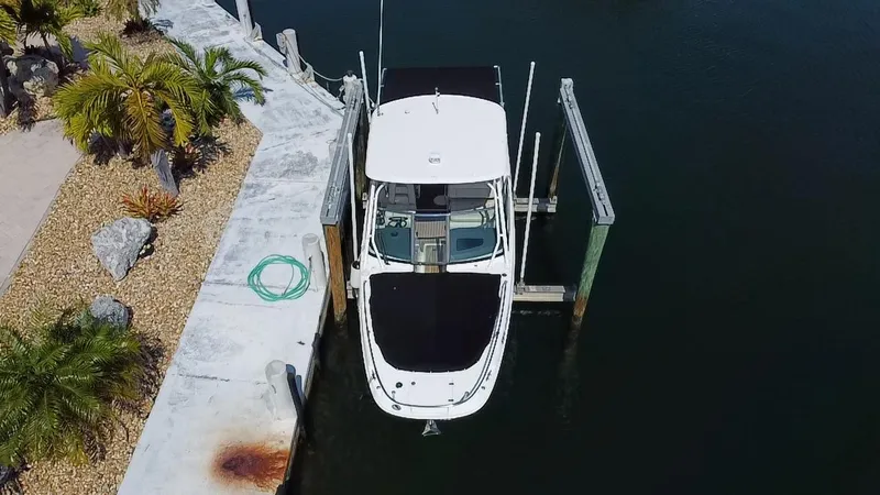 Slide: The Image of 2019 Boston Whaler 270 Vantage docked at a marina, aerial view. - 6