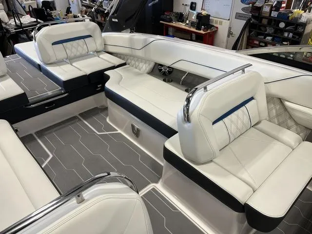 Slide: The Image of 2020 Regal LS6 Surf boat interior with white leather seating and modern design. - 10