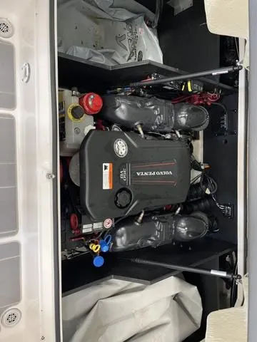 Slide: The Image of 2020 Regal LS6 Surf boat engine compartment with Volvo Penta engine. - 16