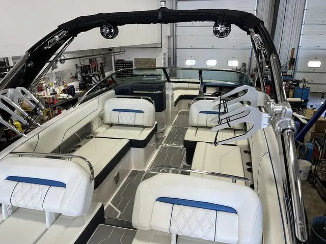 Slide: The Image of 2020 Regal LS6 Surf boat interior with white seating and modern design. - 7