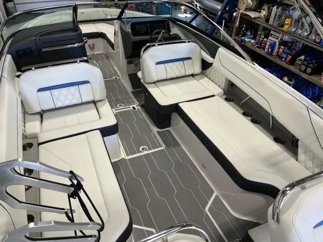 Slide: The Image of 2020 Regal LS6 Surf boat interior with white seating and modern design. - 8
