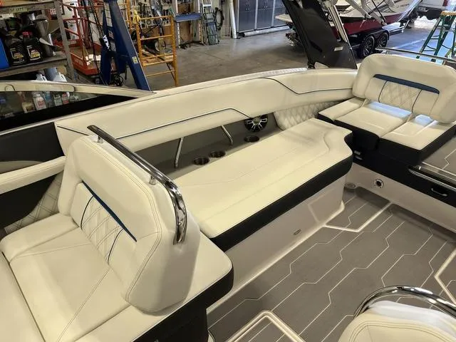 Slide: The Image of 2020 Regal LS6 Surf boat interior with white leather seating and modern design. - 9