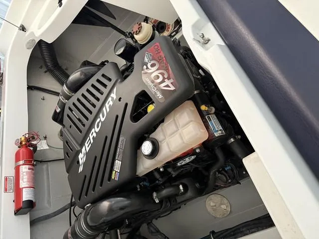 Slide: The Image of Engine compartment of a 2006 Baja 23 Outlaw boat with Mercury engine. - 10
