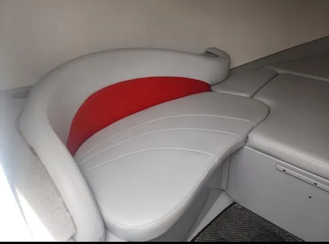 Slide: The Image of 2006 Baja 23 Outlaw boat interior with white and red seating. - 9