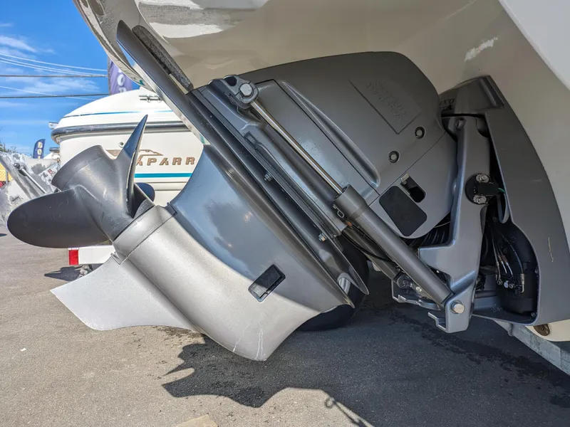 Slide: The Image of 2018 Stingray 208 LS boat outboard motor close-up, showcasing propeller and engine details. - 14