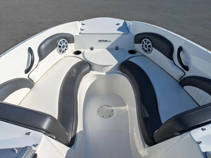 Slide: The Image of 2018 Stingray 208 LS boat interior with sleek seating and modern design. - 16