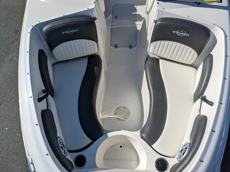 Slide: The Image of 2018 Stingray 208 LS boat interior with stylish seating and modern design. - 19