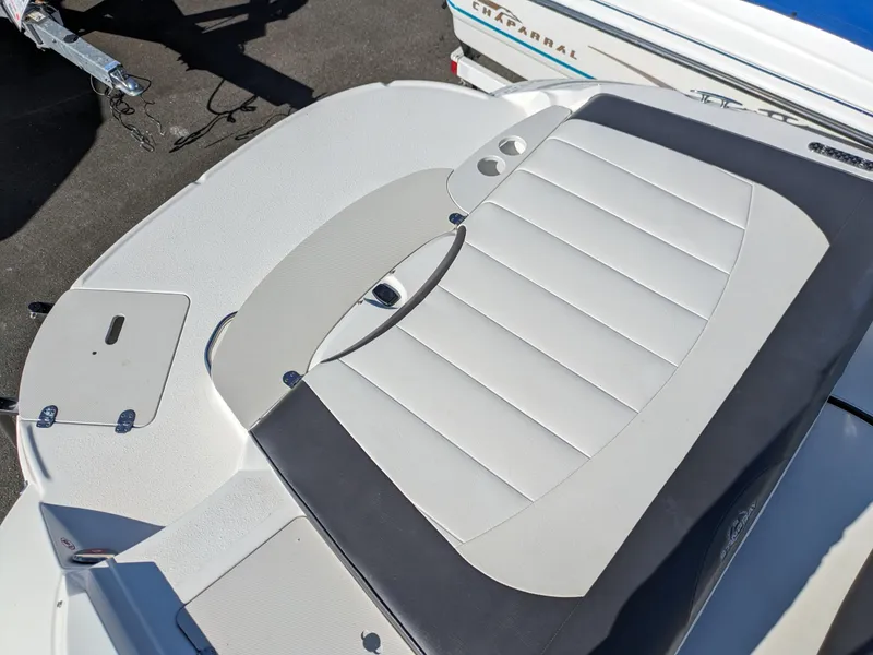 Slide: The Image of 2018 Stingray 208 LS boat with sleek white seating and deck design. - 22