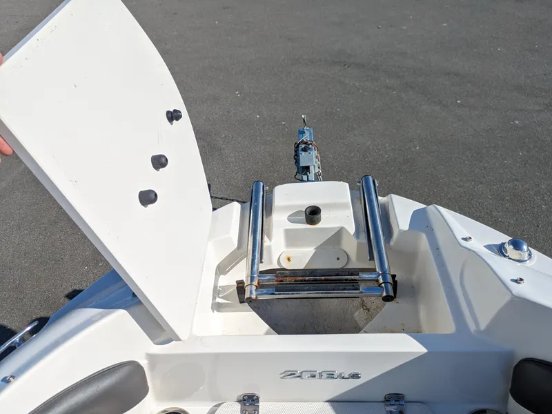 Slide: The Image of 2018 Stingray 208 LS boat with open hatch and ladder on deck. - 9