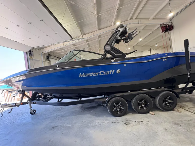 Slide: The Image of Luxurious tan interior of 2022 MasterCraft X26 boat with spacious seating and cup holders. - 5