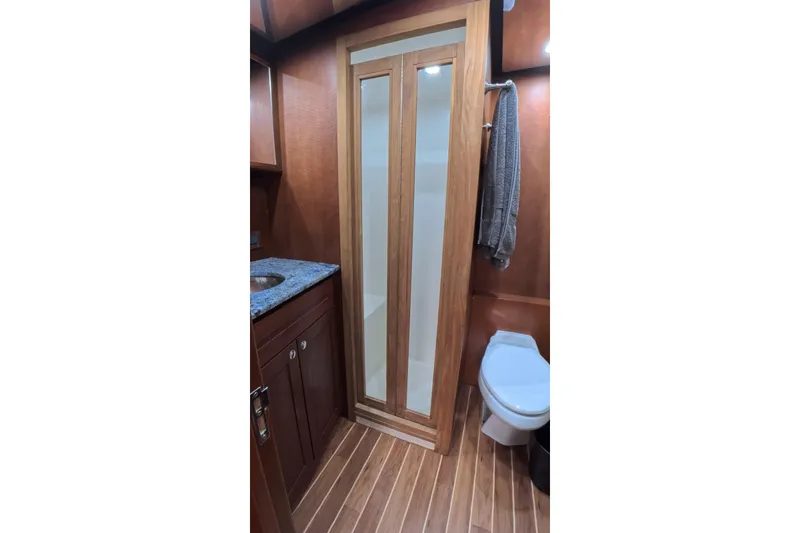 Slide: The Image of Luxurious 2012 Custom Sportfish bathroom with wooden accents and modern fixtures. - 10