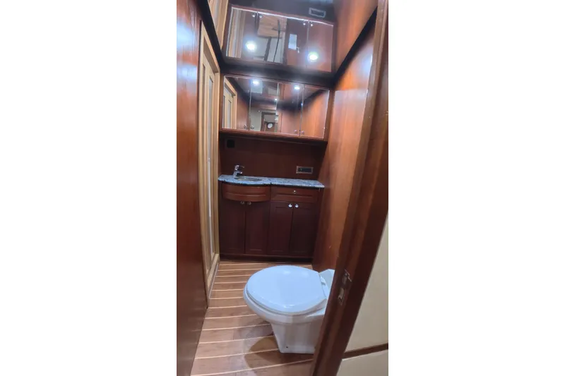 Slide: The Image of Luxurious wooden bathroom interior on a 2012 Custom Sportfish yacht. - 7