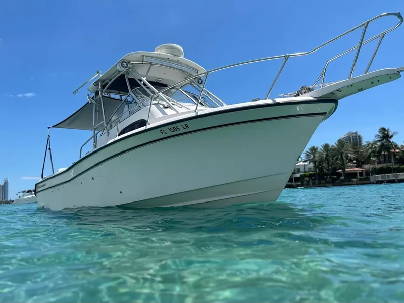 Slide: The Image of 2001 Grady-White Sailfish 282 boat on clear blue water, sunny day. - 0