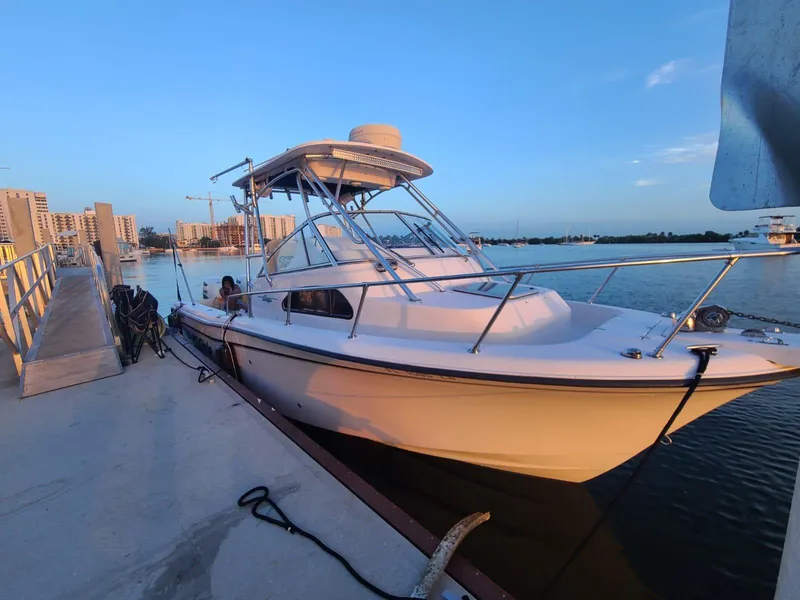 Slide: The Image of 2001 Grady-White Sailfish 282 boat docked at marina during sunset. - 1