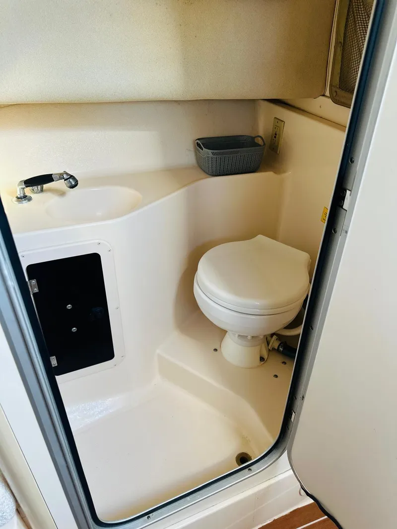 Slide: The Image of 2001 Grady-White Sailfish 282 boat bathroom interior with toilet and sink. - 3