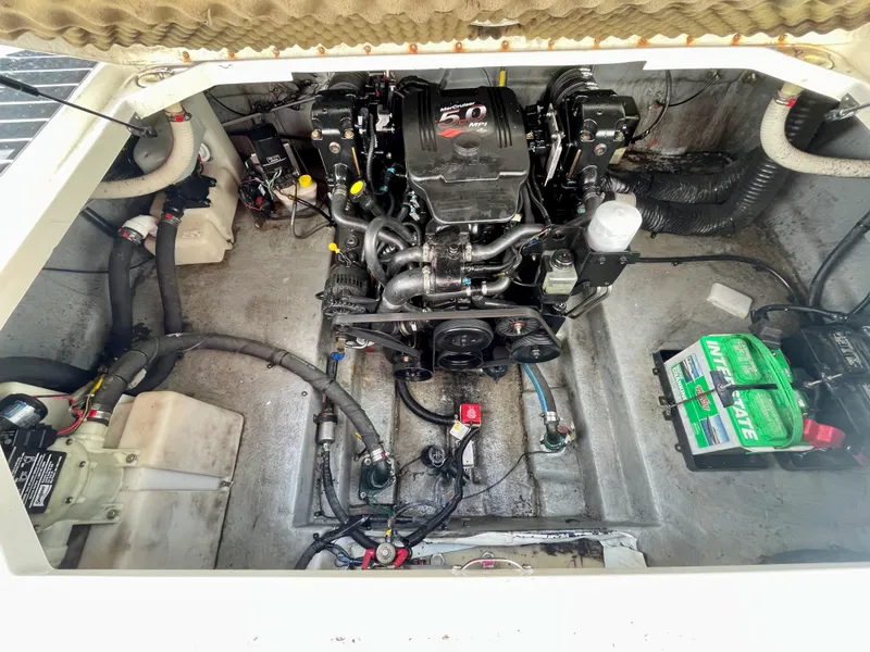 Slide: The Image of Engine compartment of a 2004 Sea Ray 260 Sundancer boat. - 13