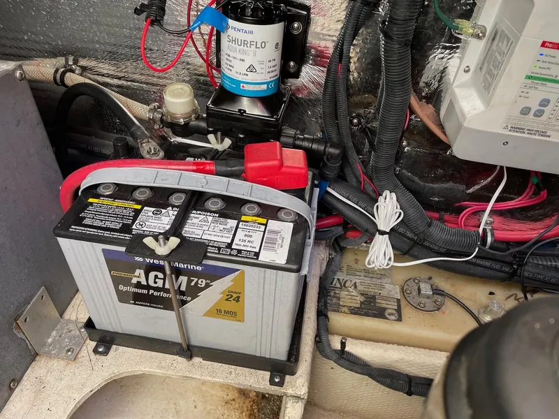 Slide: The Image of Battery and wiring setup in a 2010 Regal 2565 Window Express boat. - 26