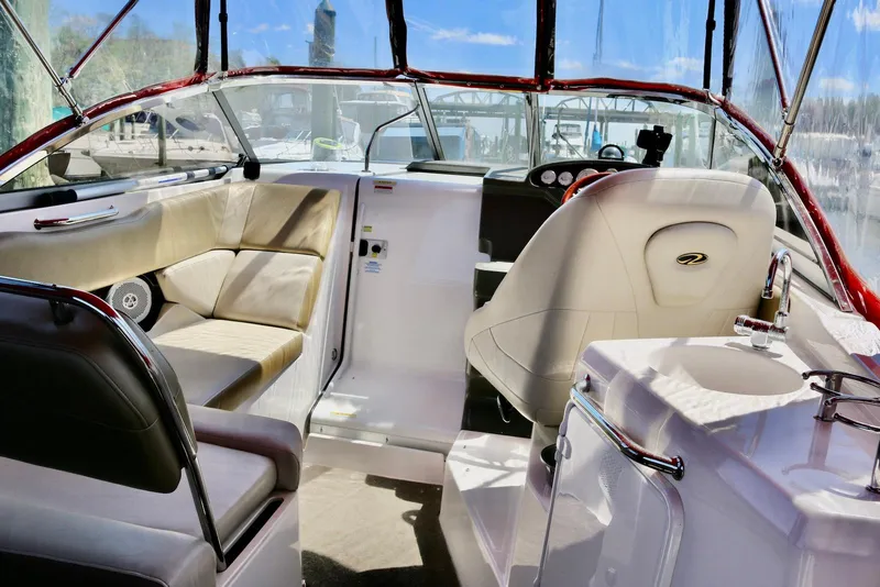 Slide: The Image of 2010 Regal 2565 Window Express boat interior with seating and helm. - 3