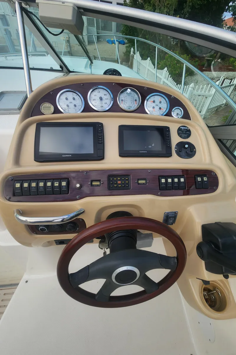Slide: The Image of 2004 Chaparral Signature 290 dashboard with gauges, controls, and steering wheel. - 15