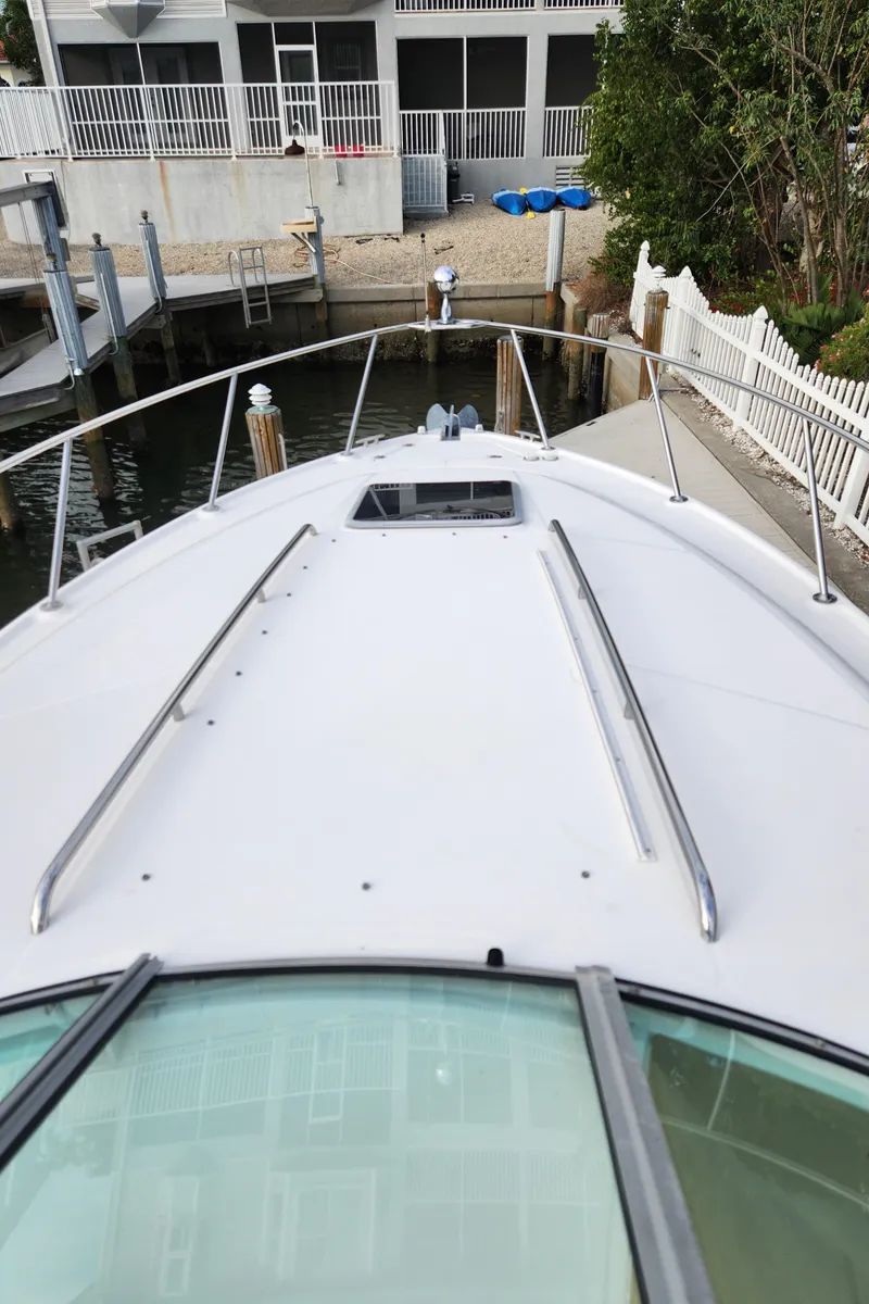 Slide: The Image of 2004 Chaparral Signature 290 boat docked near waterfront property. - 17