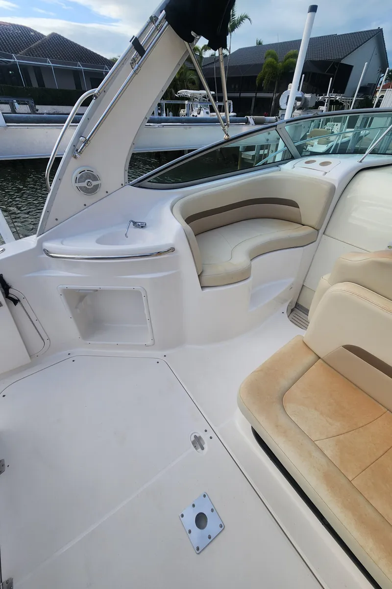 Slide: The Image of 2004 Chaparral Signature 290 boat interior with seating and deck details. - 18