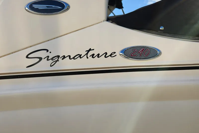 Slide: The Image of 2004 Chaparral Signature 290 boat logo on hull, close-up view. - 7