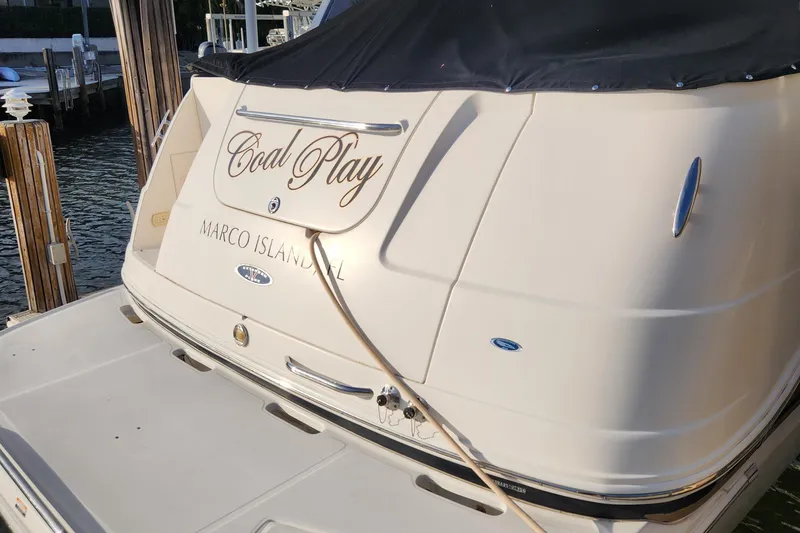 Slide: The Image of 2004 Chaparral Signature 290 interior with cozy seating and wooden table. - 8