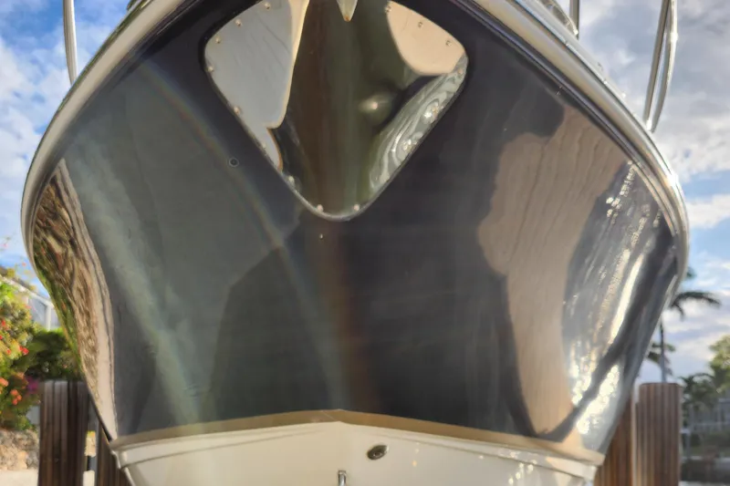 Slide: The Image of 2004 Chaparral Signature 290 boat hull, close-up view with reflective surface. - 9