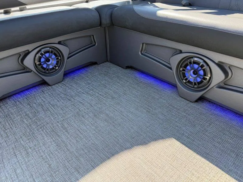 Slide: The Image of 2022 Tahoe LTZ VRB 2485 interior with speakers and blue LED lighting. - 14