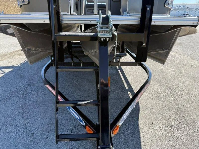 Slide: The Image of 2022 Tahoe LTZ VRB 2485 boat trailer with ladder on asphalt surface. - 20