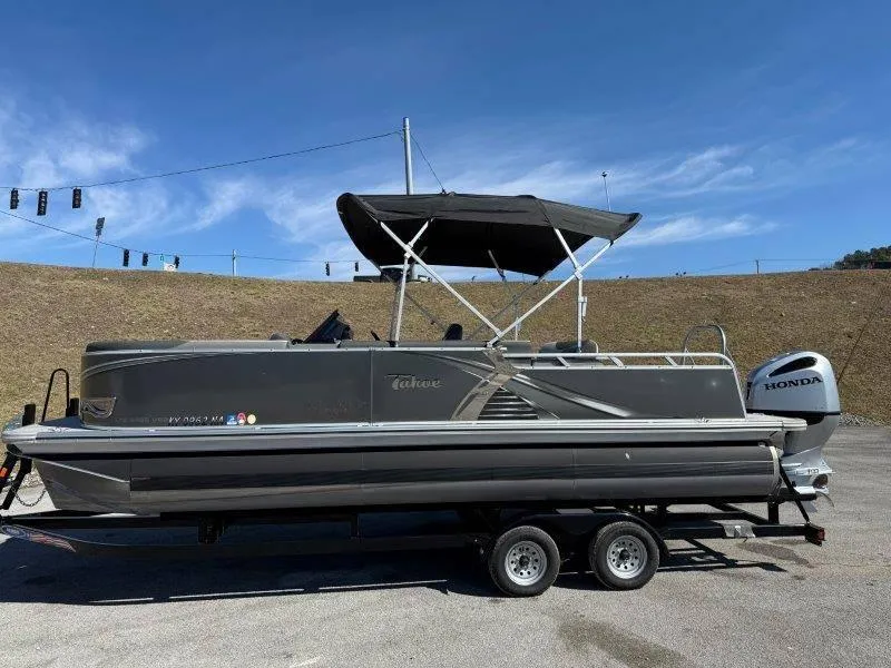Slide: The Image of 2022 Tahoe LTZ VRB 2485 pontoon boat with Honda engine on trailer. - 26