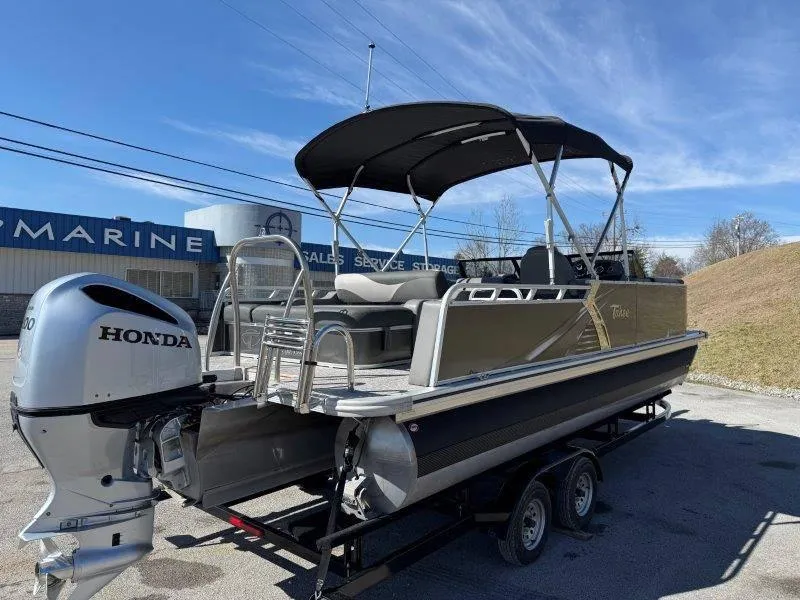 Slide: The Image of 2022 Tahoe LTZ VRB 2485 pontoon boat with Honda outboard motor on trailer. - 30