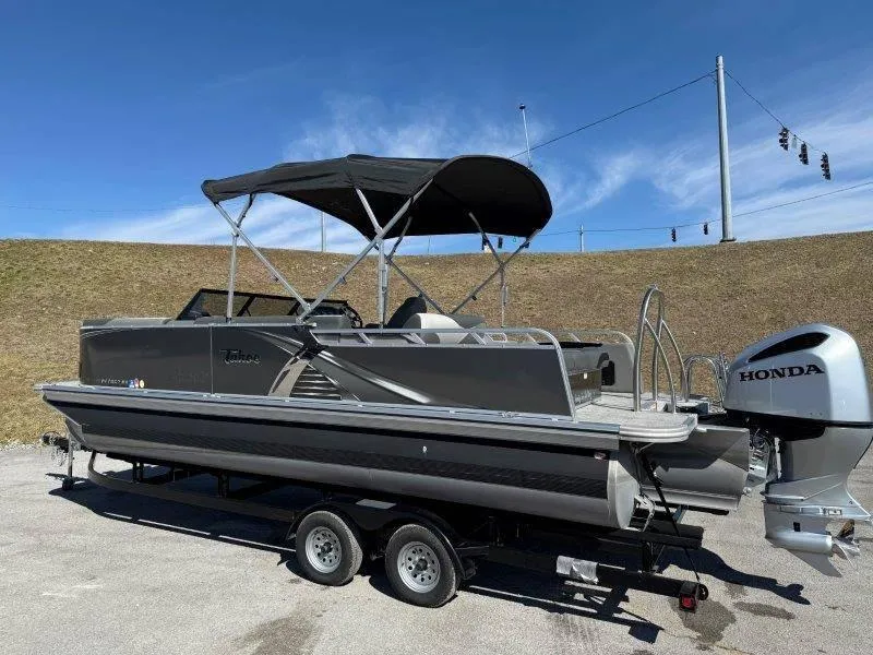 Slide: The Image of 2022 Tahoe LTZ VRB 2485 pontoon boat with Honda outboard motor on trailer. - 31