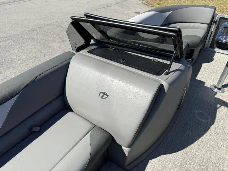 Slide: The Image of 2022 Tahoe LTZ VRB 2485 boat interior with gray seating and storage compartment. - 33