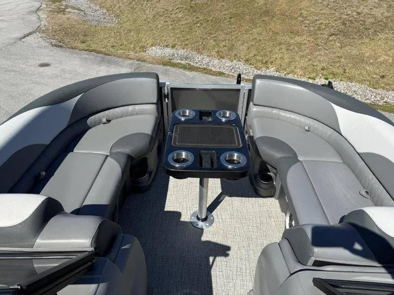 Slide: The Image of 2022 Tahoe LTZ VRB 2485 boat interior with gray seating and a central table. - 34