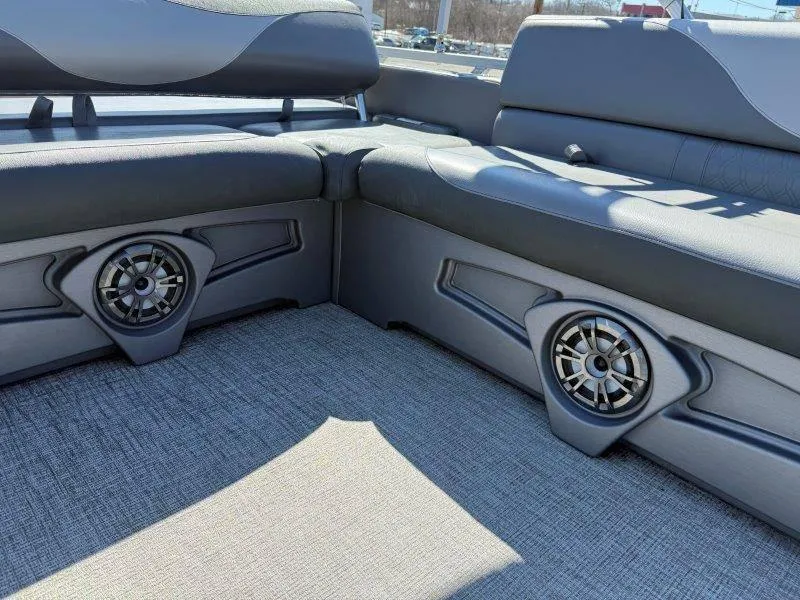 Slide: The Image of 2022 Tahoe LTZ VRB 2485 boat interior with stylish seating and built-in speakers. - 37