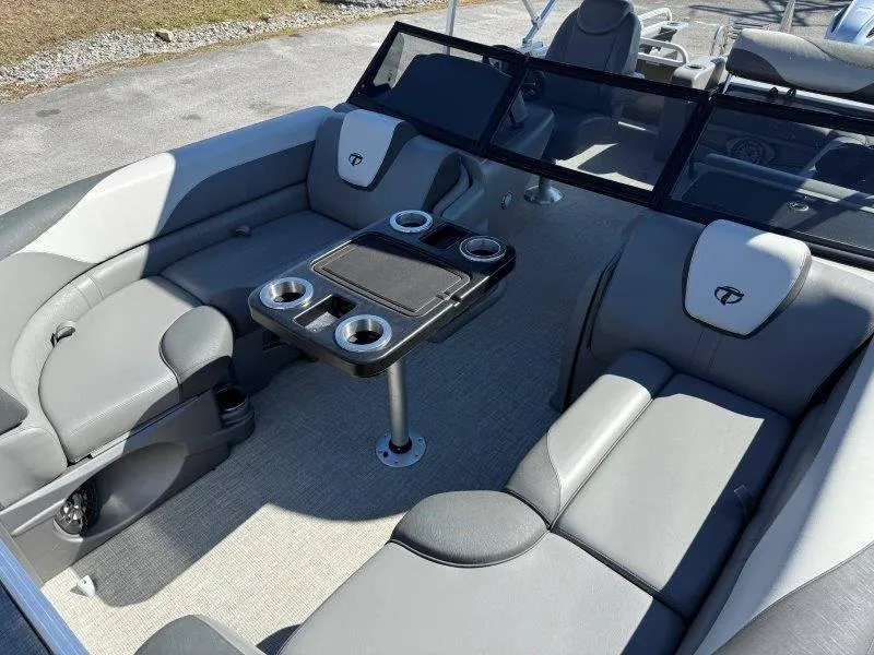 Slide: The Image of 2022 Tahoe LTZ VRB 2485 boat interior with gray seating and table. - 38