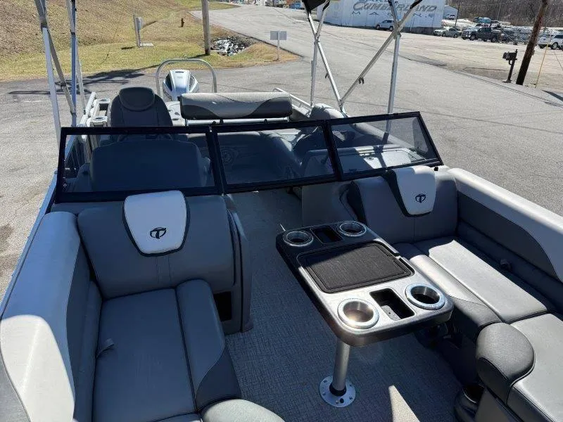 Slide: The Image of 2022 Tahoe LTZ VRB 2485 pontoon boat interior with seating and table. - 39