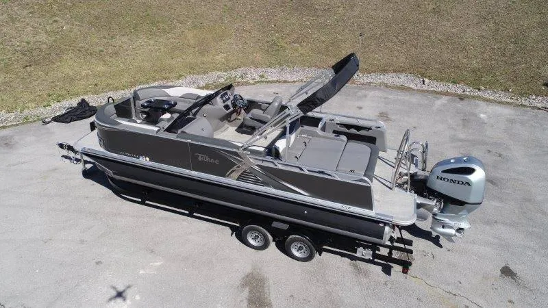 Slide: The Image of 2022 Tahoe LTZ VRB 2485 pontoon boat with Honda outboard motor on trailer. - 4