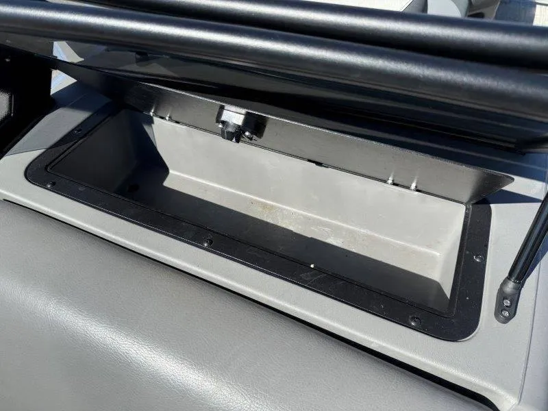 Slide: The Image of Open storage compartment in a 2022 Tahoe LTZ VRB 2485 boat. - 41