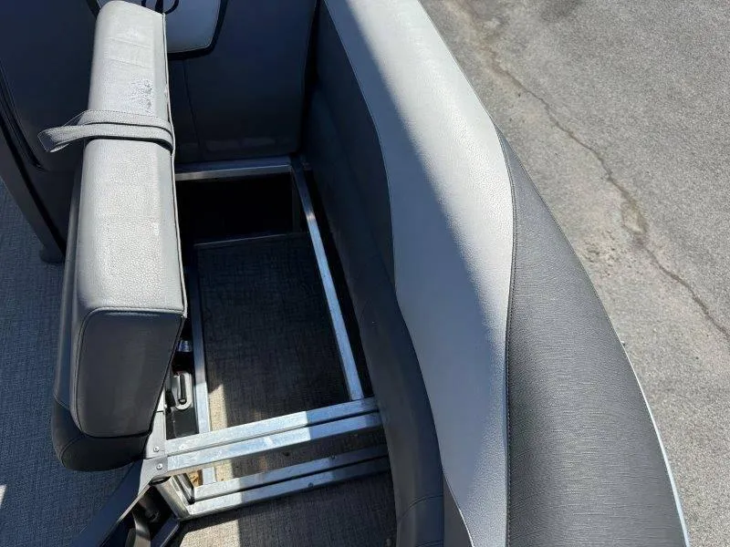 Slide: The Image of 2022 Tahoe LTZ VRB 2485 boat interior seating with storage compartment. - 44