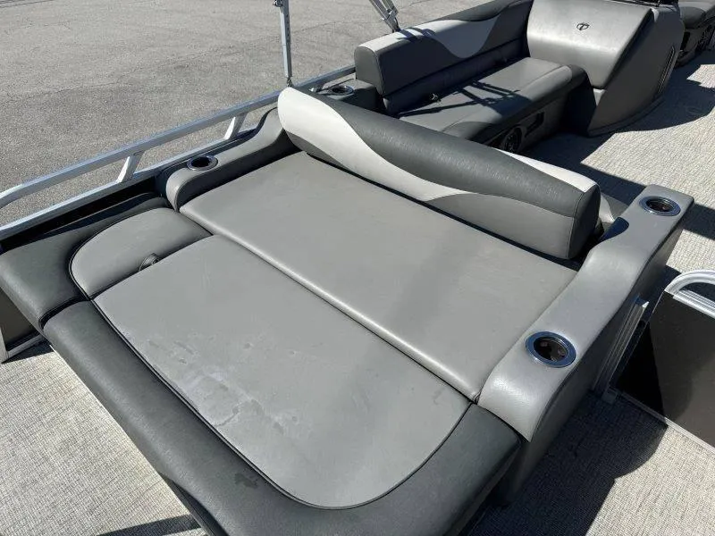 Slide: The Image of 2022 Tahoe LTZ VRB 2485 boat interior with gray seating and cup holders. - 48