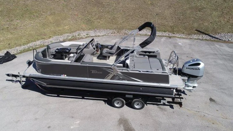 Slide: The Image of 2022 Tahoe LTZ VRB 2485 pontoon boat with Honda outboard motor on trailer. - 5