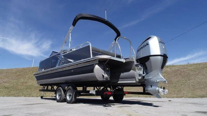 Slide: The Image of 2022 Tahoe LTZ VRB 2485 pontoon boat with Honda engine on trailer. - 7