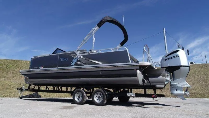 Slide: The Image of 2022 Tahoe LTZ VRB 2485 pontoon boat with Honda outboard motor on trailer. - 8