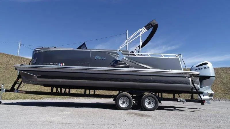 Slide: The Image of 2022 Tahoe LTZ VRB 2485 pontoon boat on trailer with Honda outboard motor. - 9