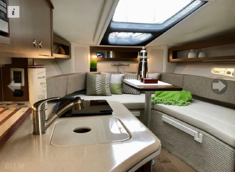 Slide: The Image of Interior of 2017 Sea Ray Sundancer 280 yacht with modern kitchen and cozy seating area. - 5